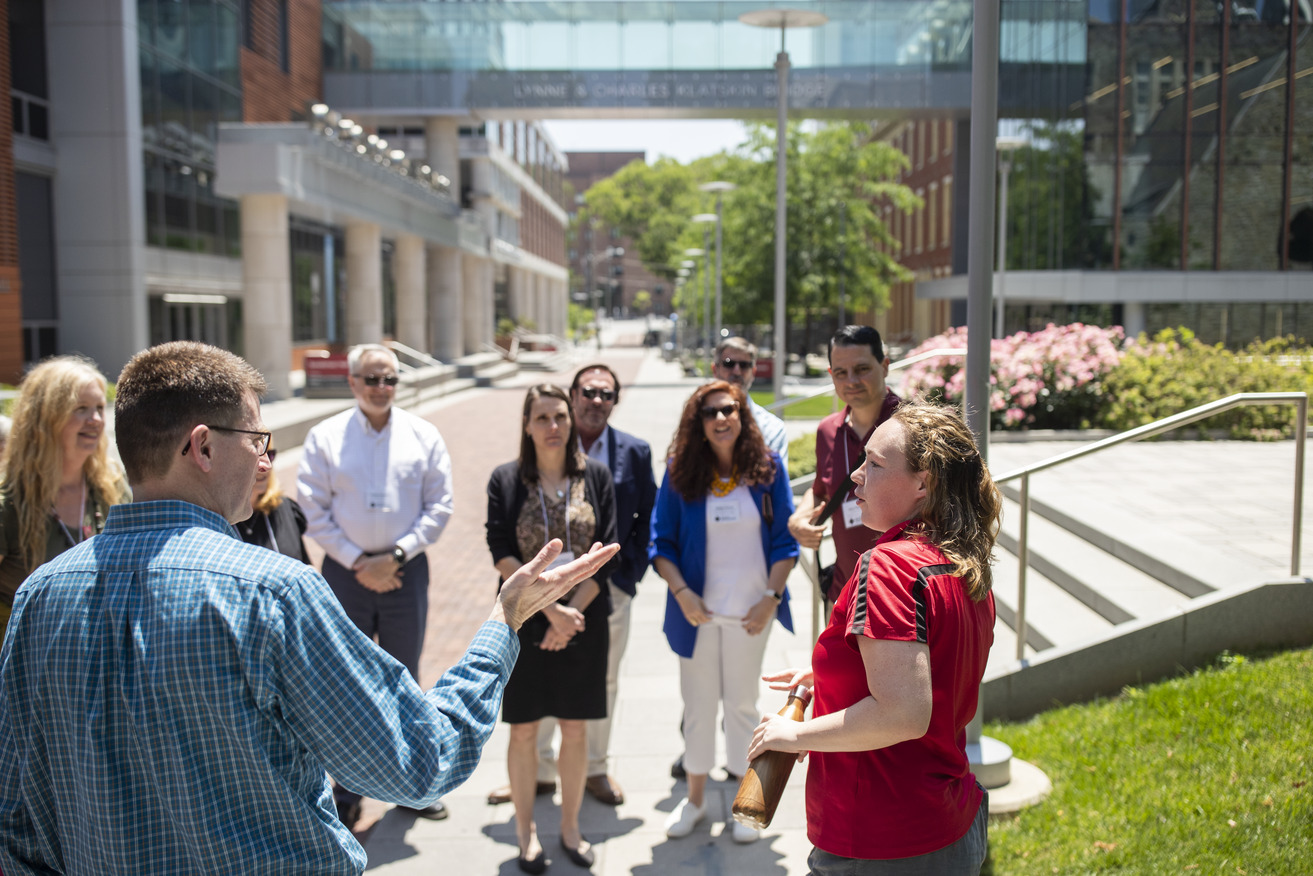 Image of group of higher ed leaders touring Temple s campus