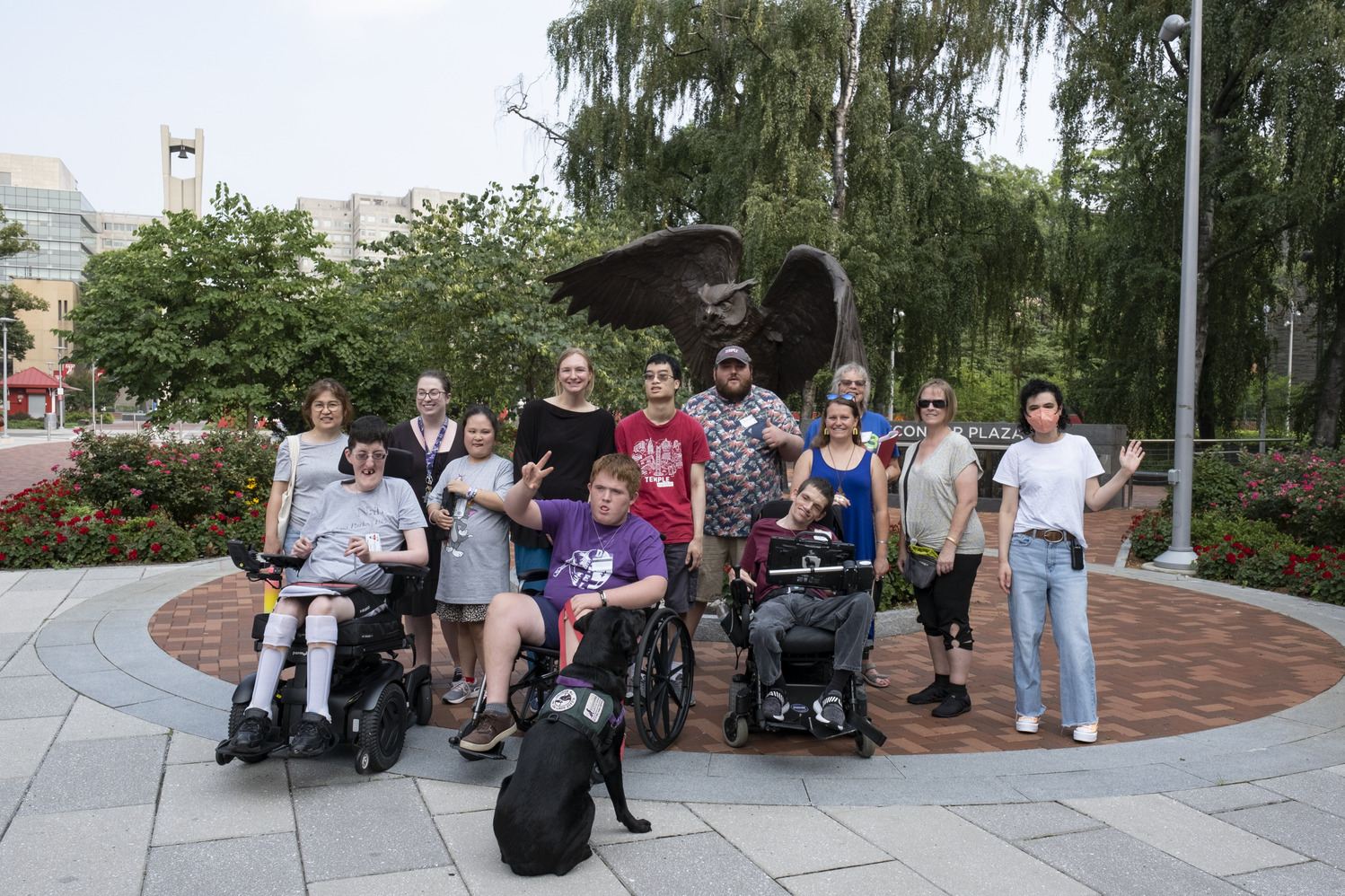 ACES 2023 participants in front of the Owl statue