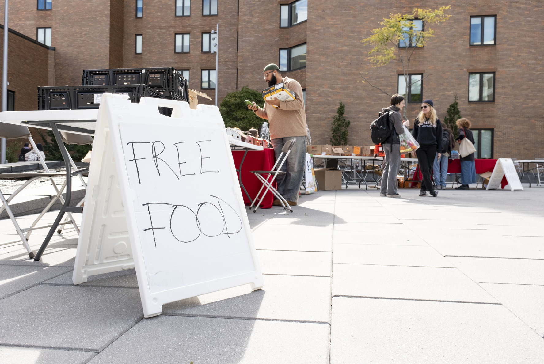 A sign at the World Food Day event reads FREE FOOD