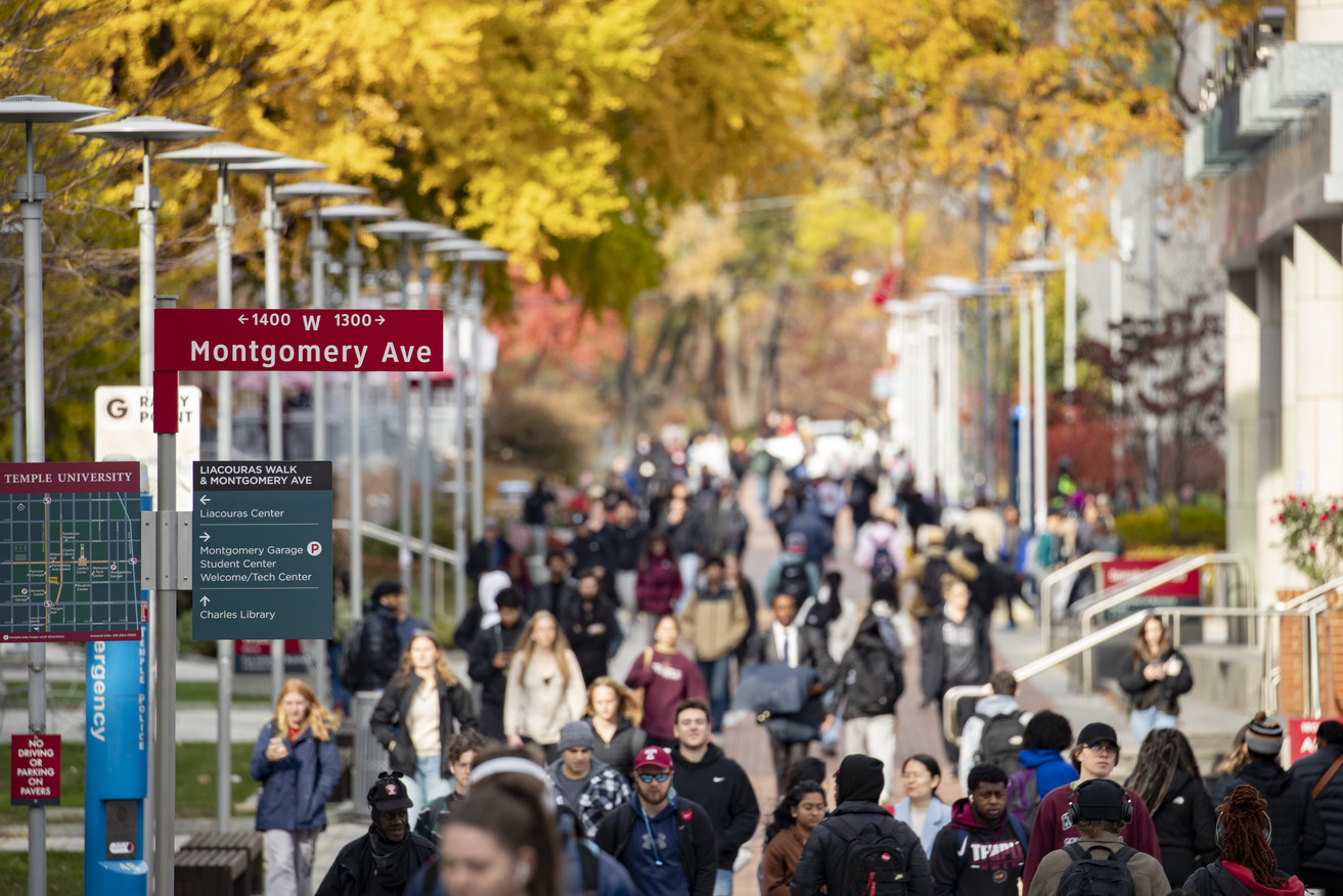 Temple students walking across campus.