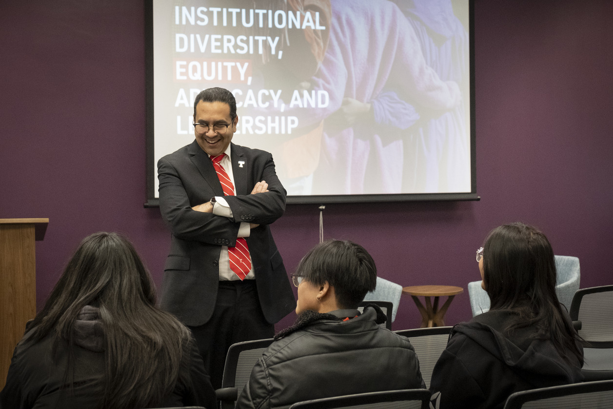 Jose Aviles speaking with high school students at an outreach event at Temple