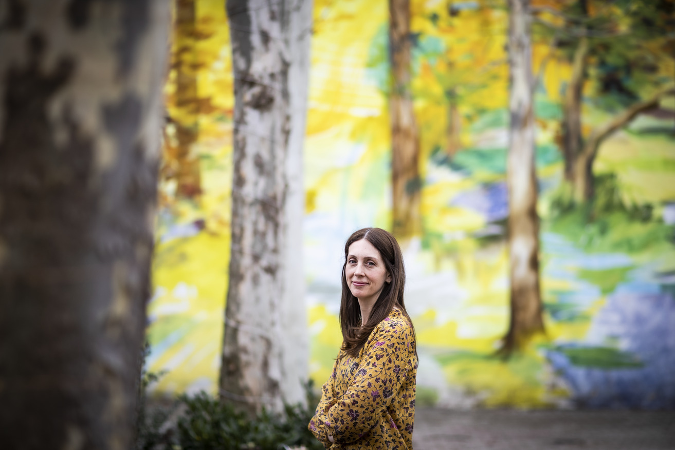 Liz Moore standing outside near trees