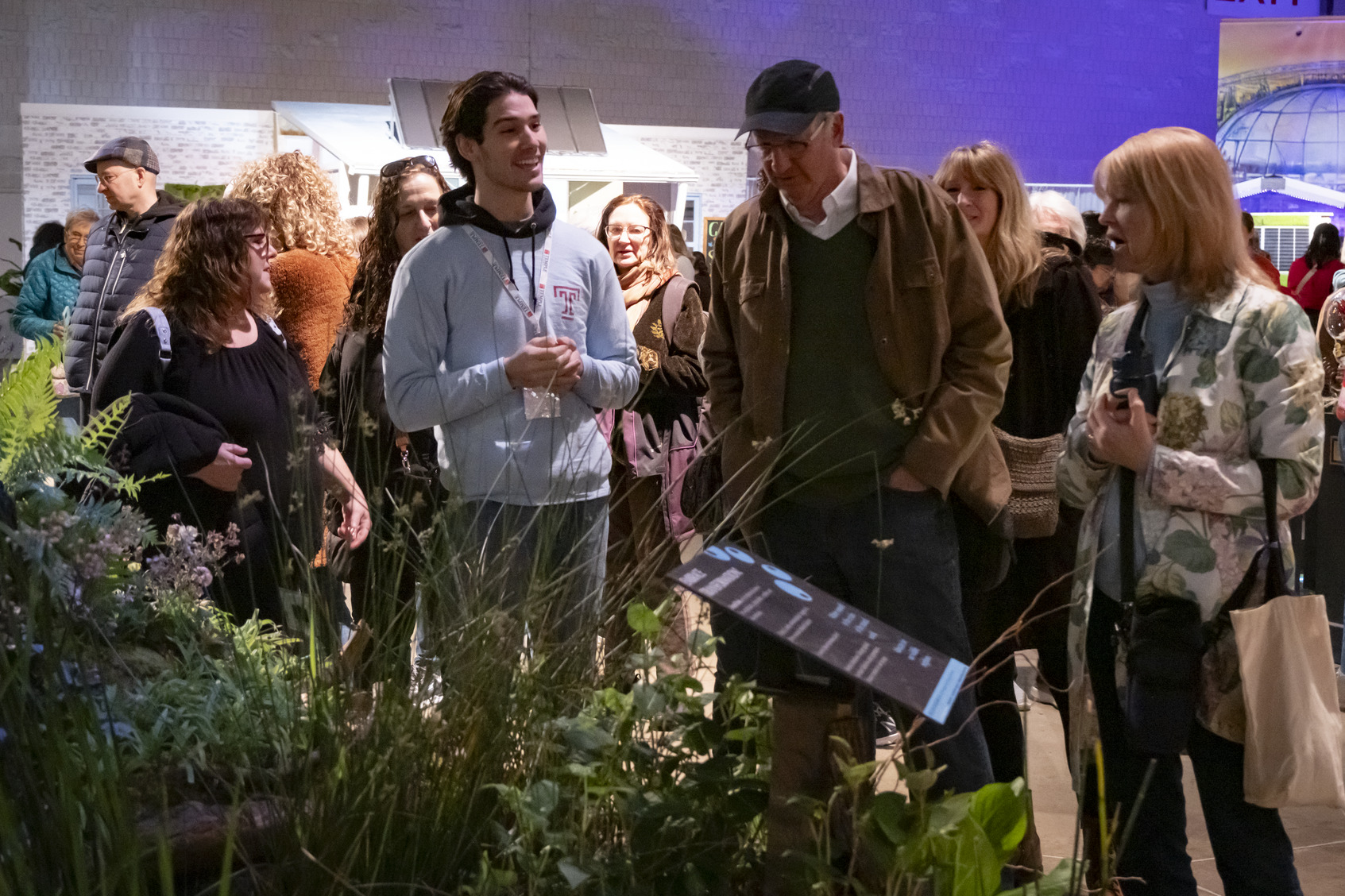 A Temple student presenting the exhibit at the 2025 Philadelphia Flower Show