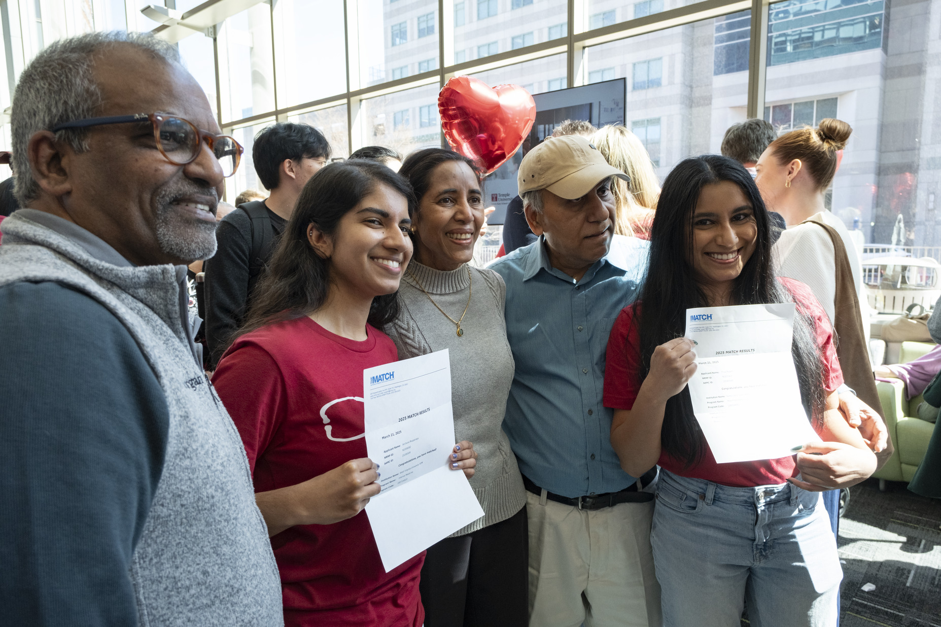 Students and their family celebrating Match Day 2025 at Temple's Lewis Katz School of Medicine.