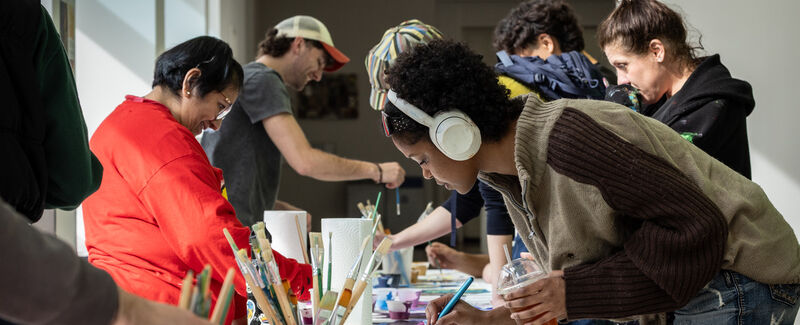 students engaging in collaborative painting