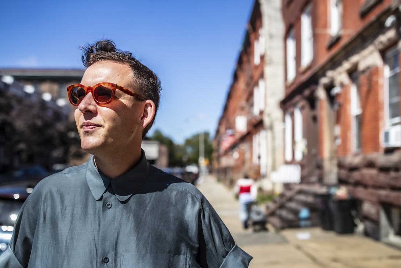 Bench Ansfield standing outside a neighborhood near Main Campus