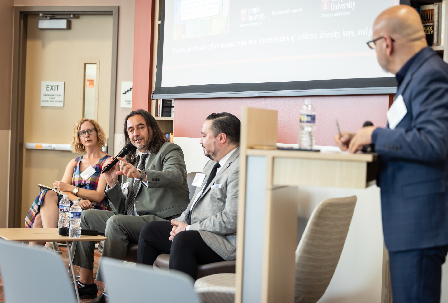 Miguel Mostaf , Mariola V. Alvarez and Michael Usino speaking in the Center for Anti-Racism