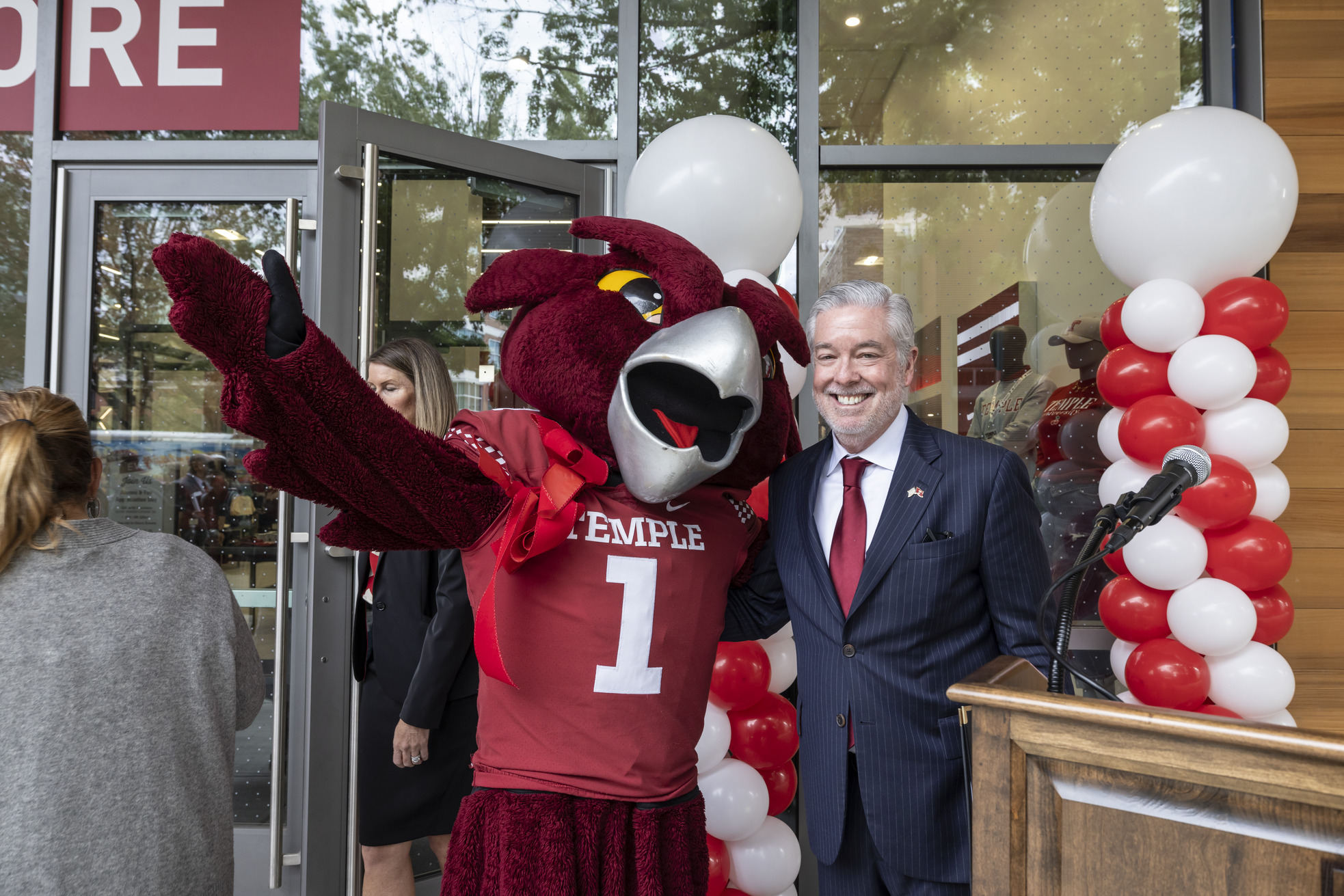 President Fry poses with Hooter the Owl mascot at bookstore grand opening