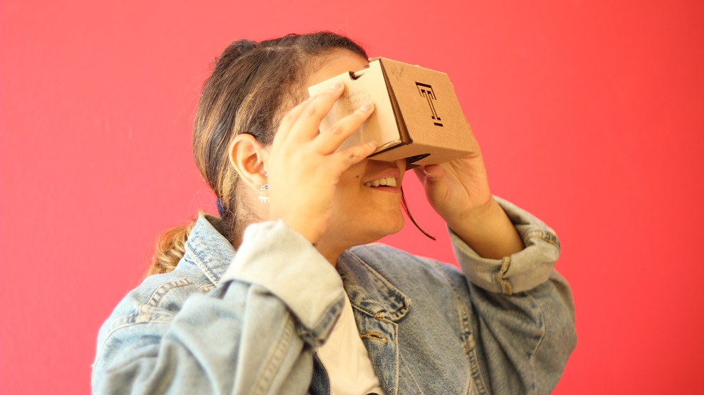 student looking through 360 video screening glasses