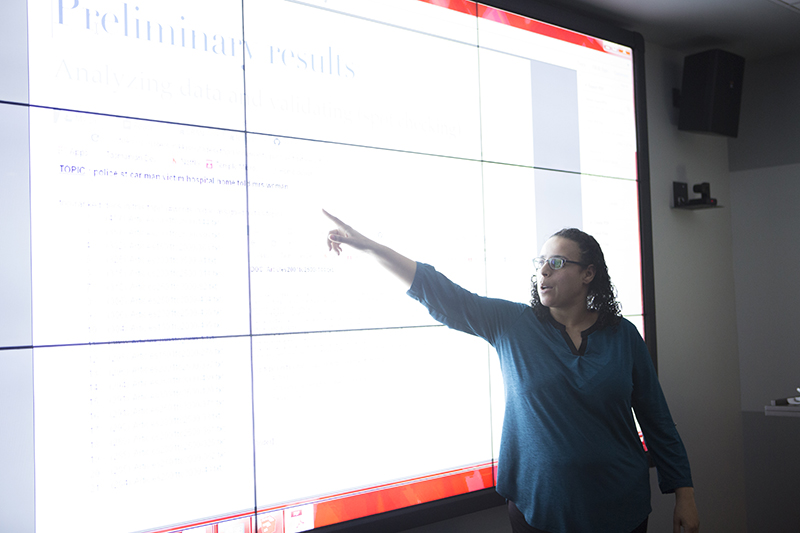 woman pointing to screen
