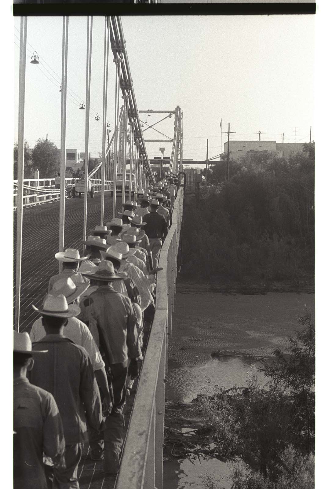 workers crossing a bridge