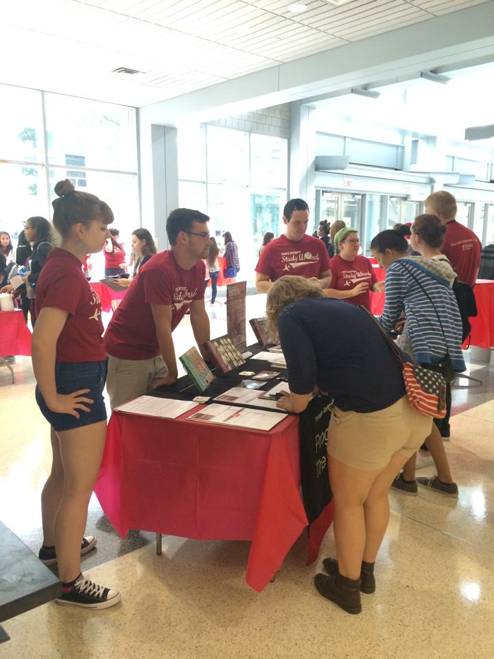 Students speak with Peer Advisors at an Info Table