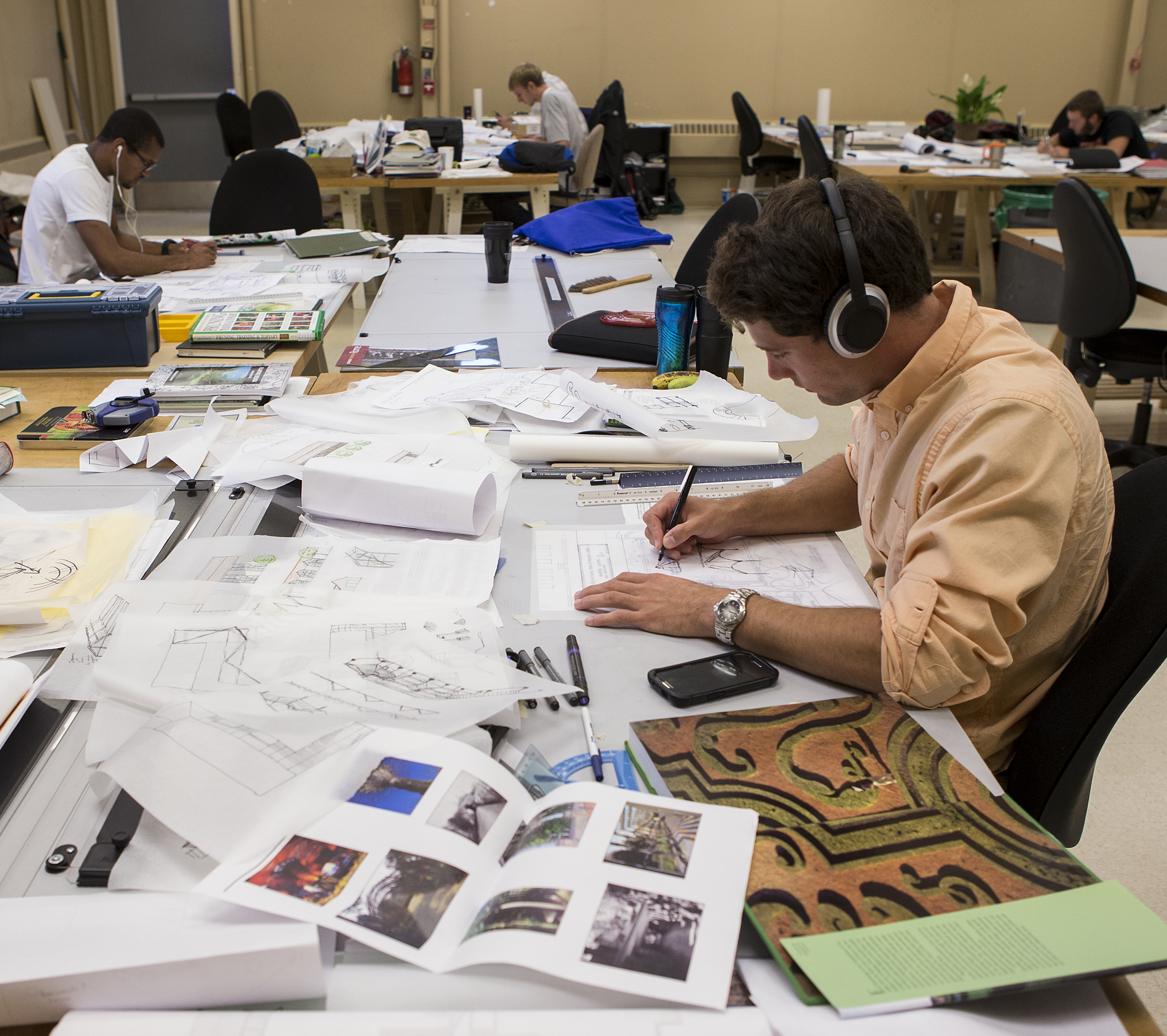 A landscape architecture student works on a design.