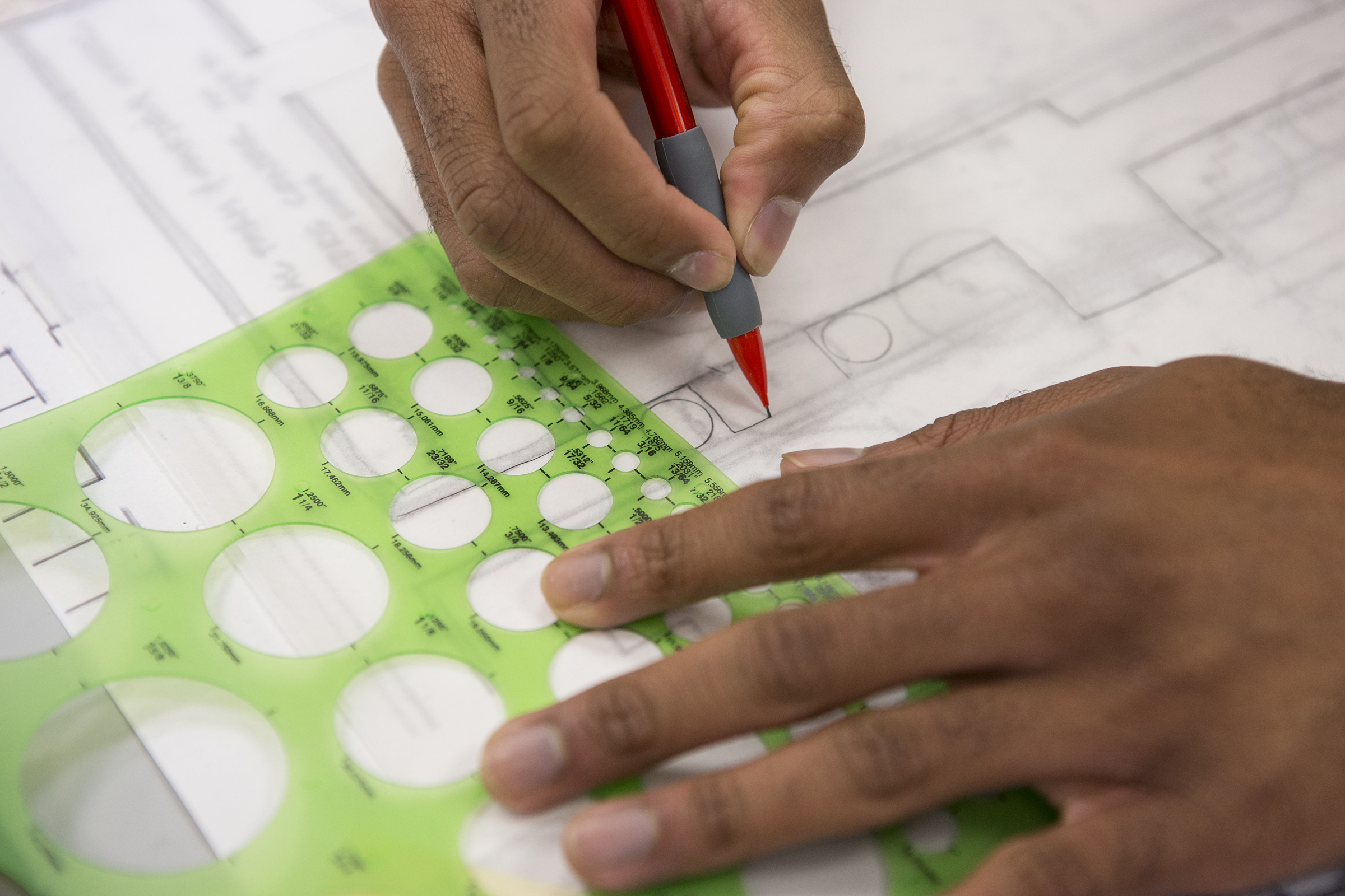 A landscape architecture student works on a design.