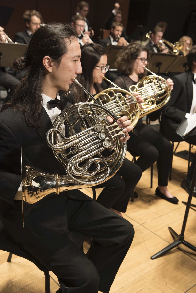 french horn players in a wind ensemble