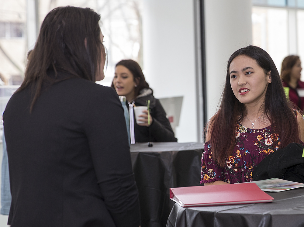 student and alum talking
