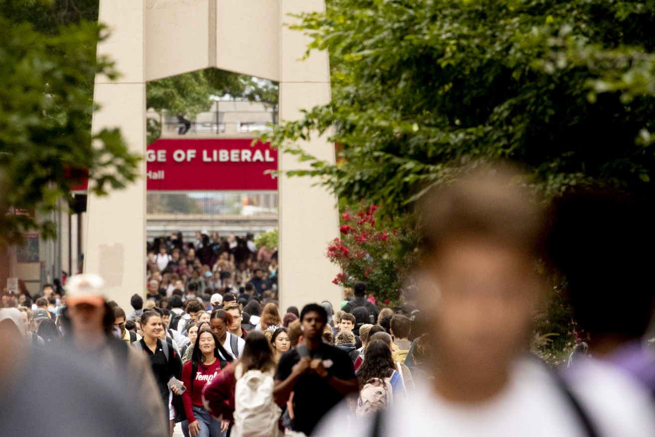 Students on campus near the bell tower.