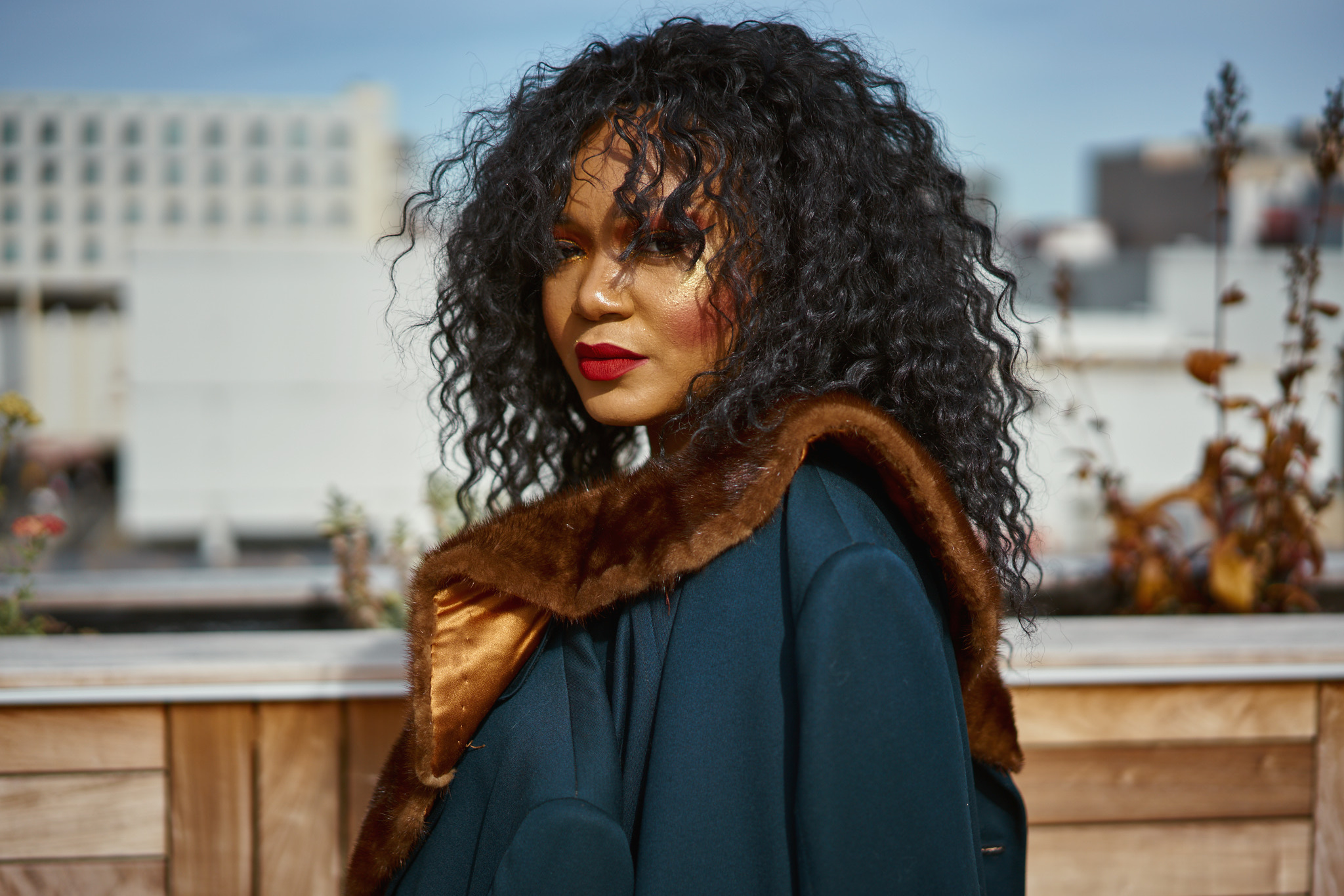 Image of Camille Bell in an outdoor space, looking into camera