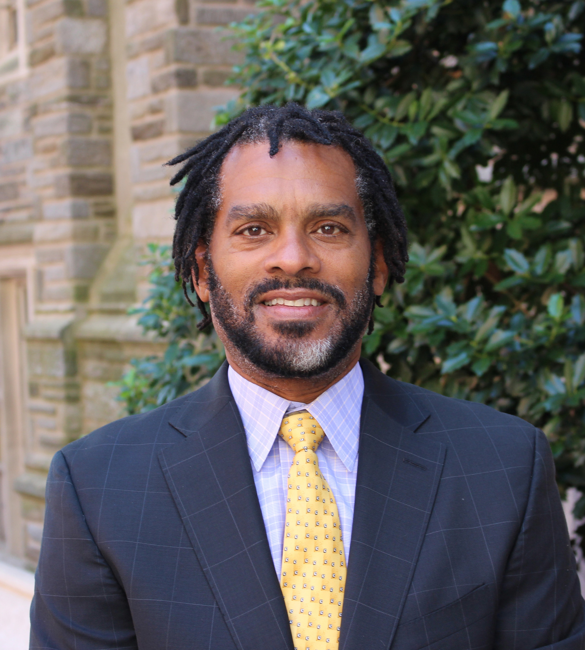 Image of Donald P. Harris standing in front of a tree.