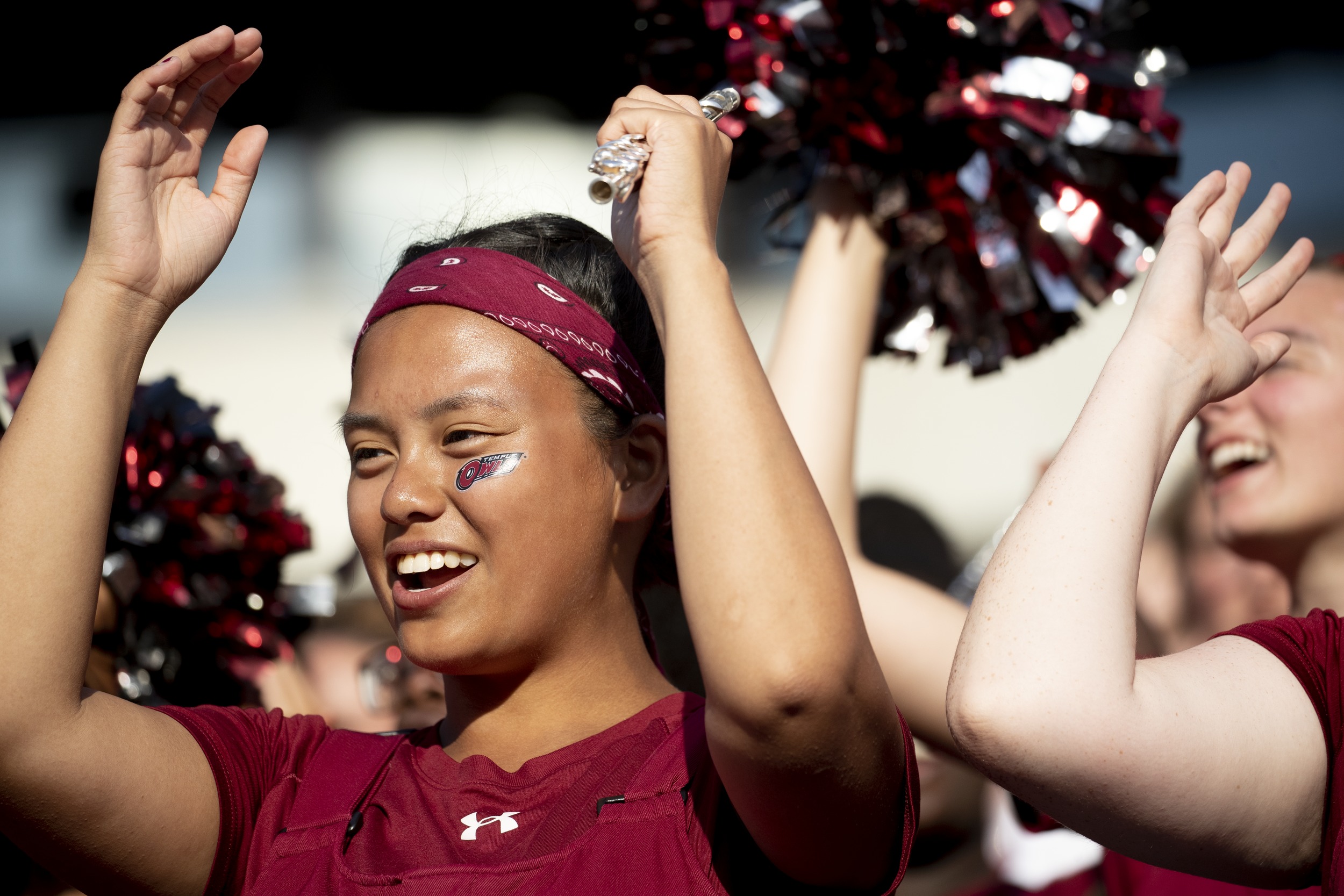 TempleDiamond Marching Band performing T for Temple U at a football game