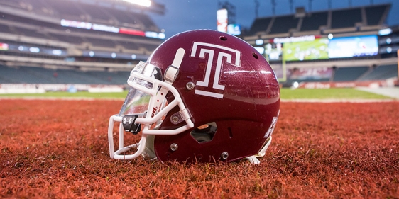 A cherry Temple football helmet with a white Temple T.