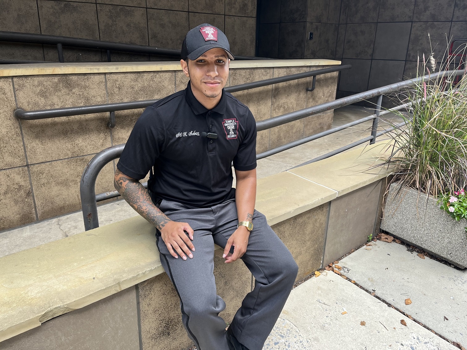 Heru Shabazz pictured sitting outside the offices of the Department of Public Safety.