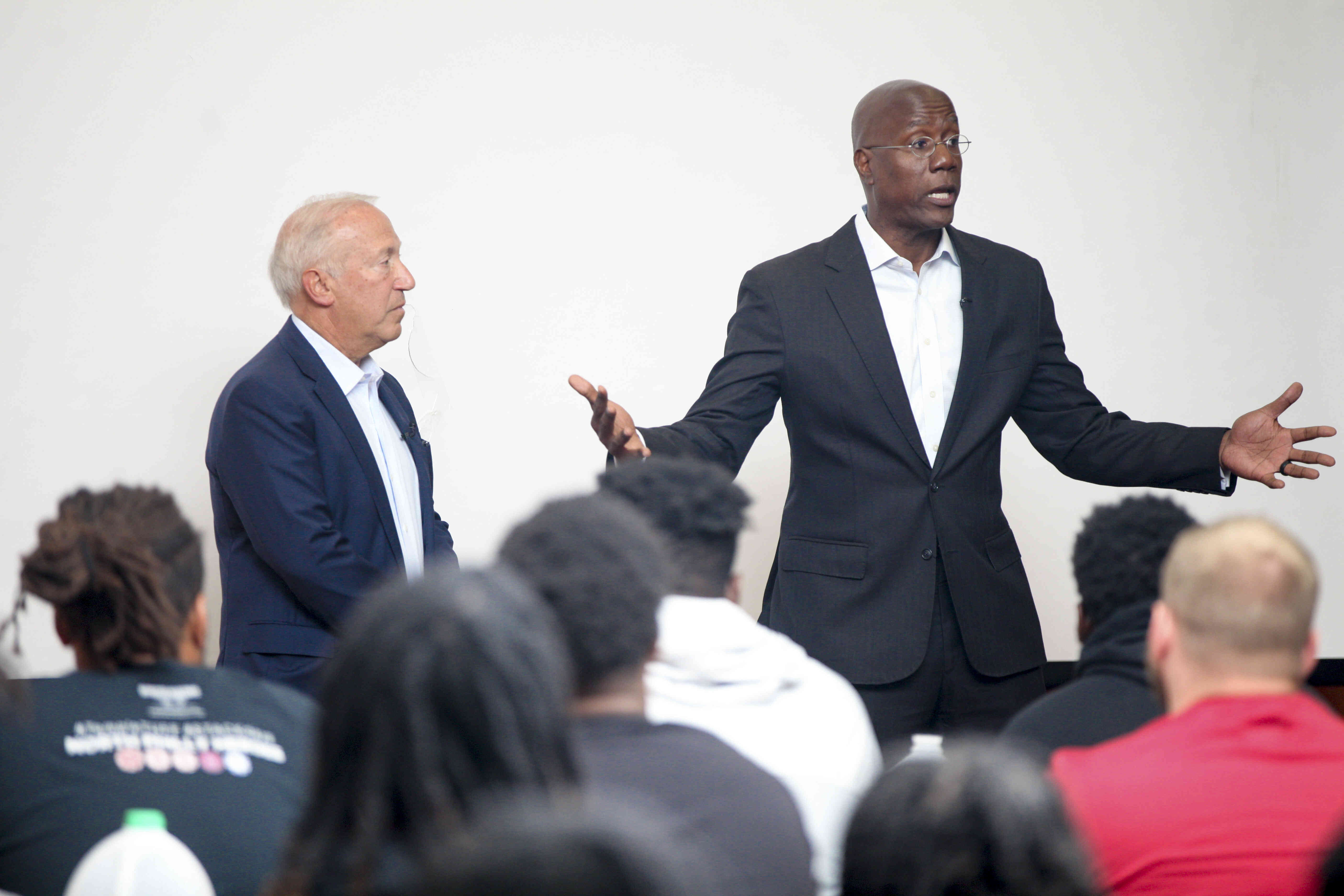 Board of Trustees Chair Mitchell Morgan and President Jason Wingard addressing the football team.