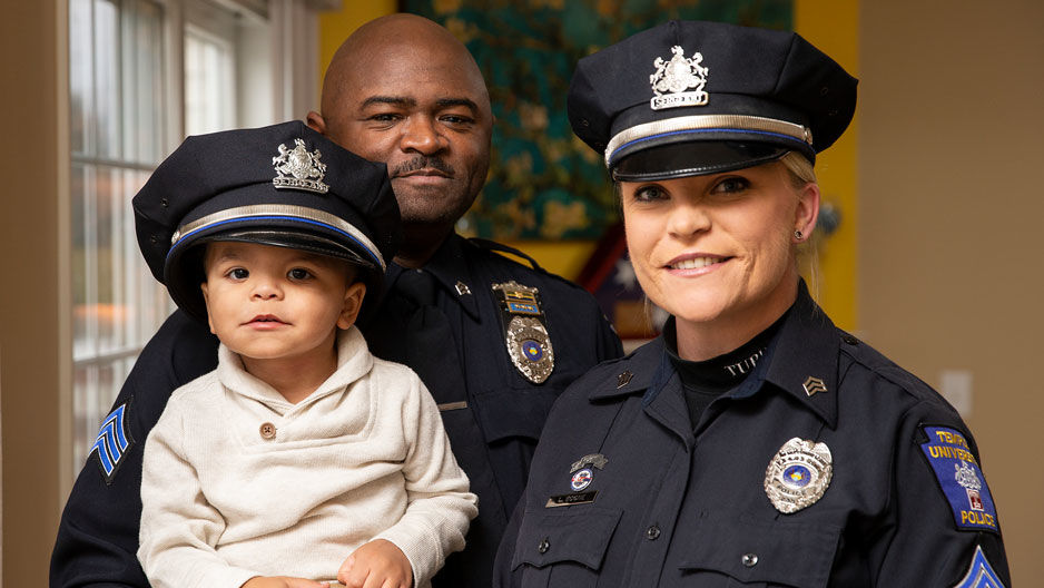 Sgts Kamari and Lauren Boone with their son Kaleb