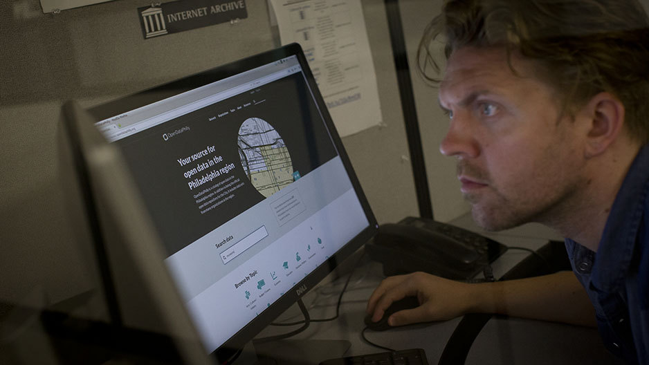 Chad Nelson is looking at OpenDataPhilly on a computer screen.