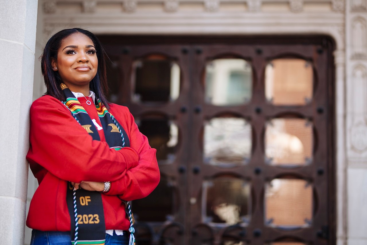 Lauren Ross leaning against a building