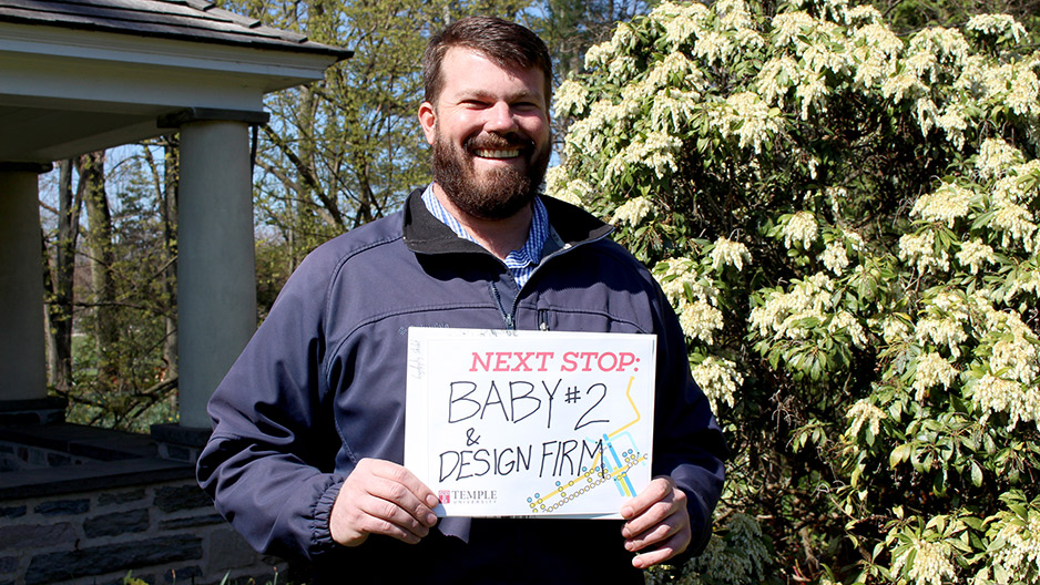 A man in a blue jacket standing on Temple s Ambler Campus.