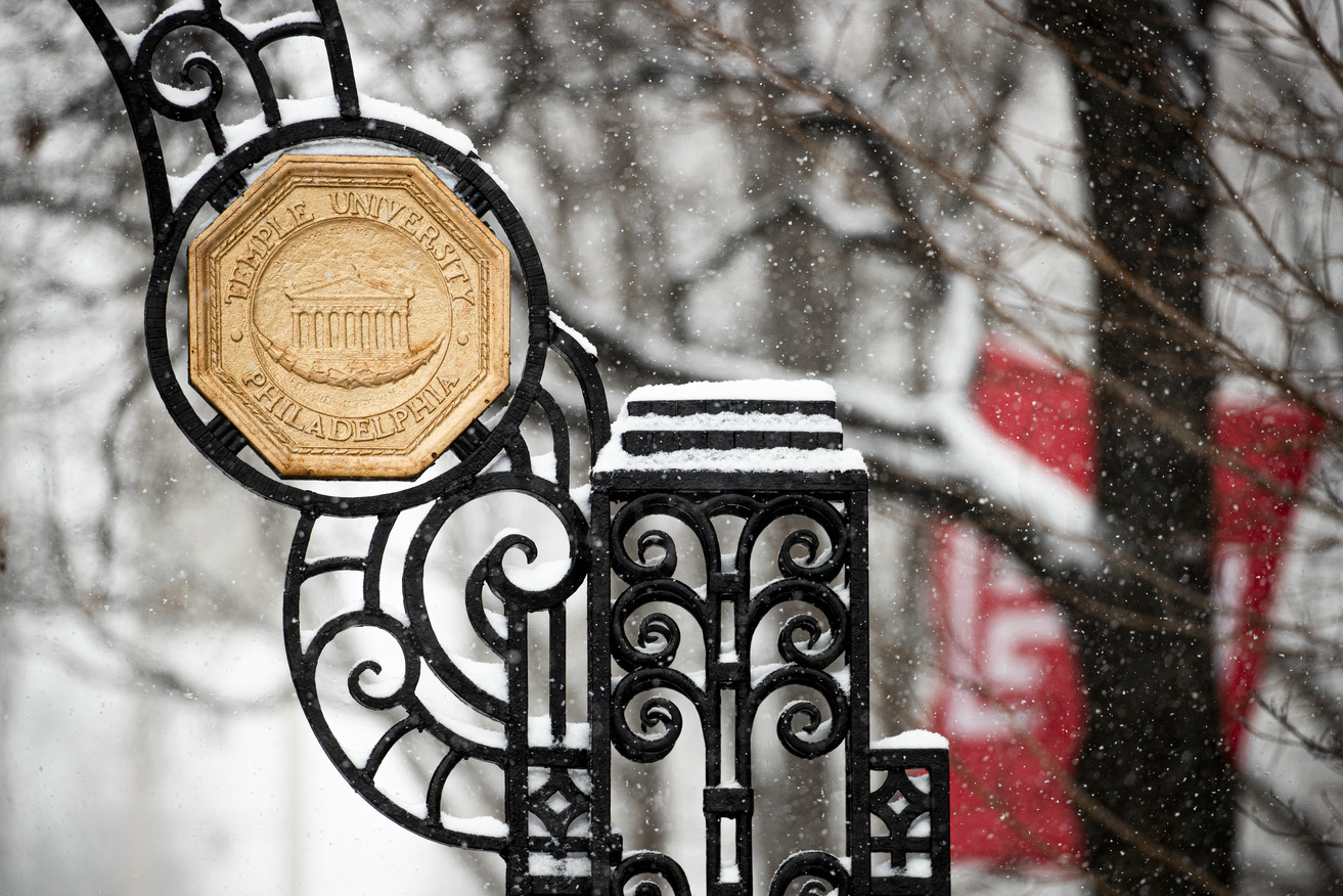 A Temple sign at the gate on Main Campus in the winter