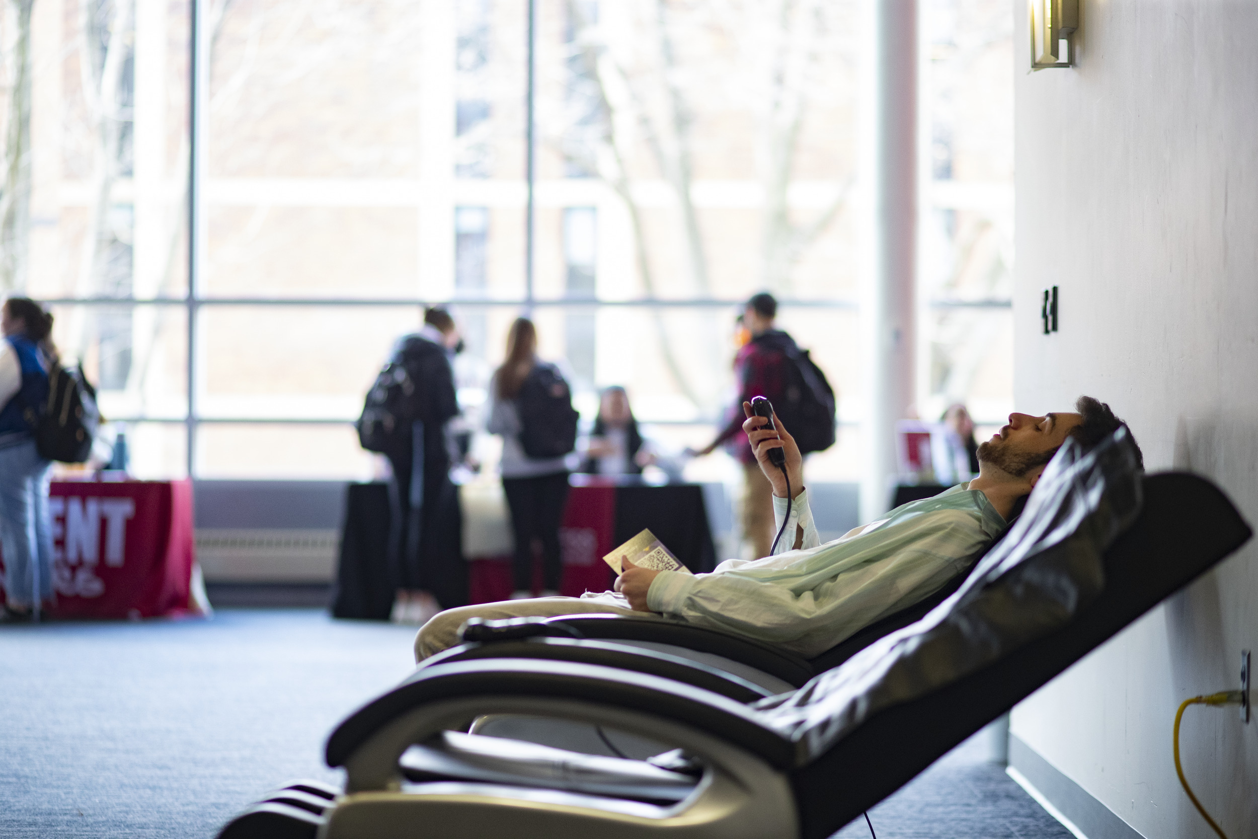 Person resting in a massage chair.