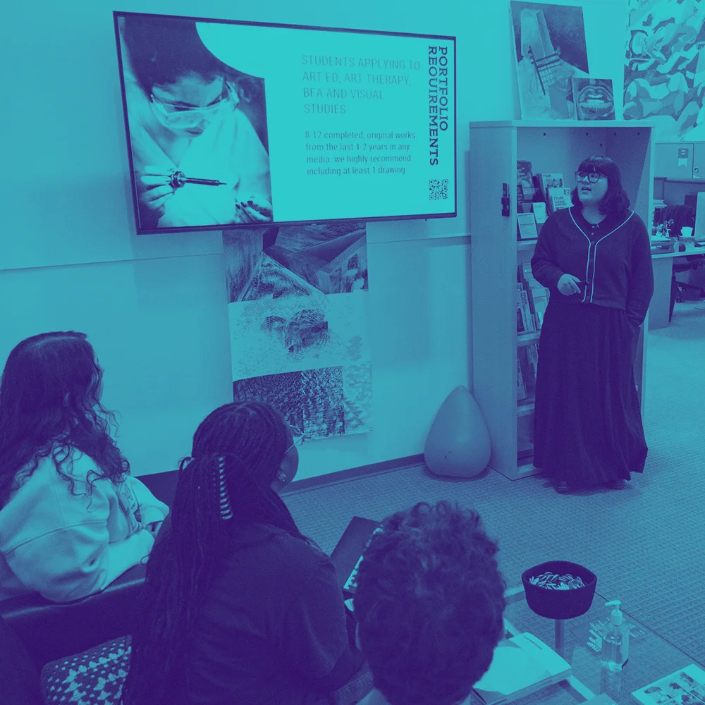 prospective students attend a presentation on portfolio requirements