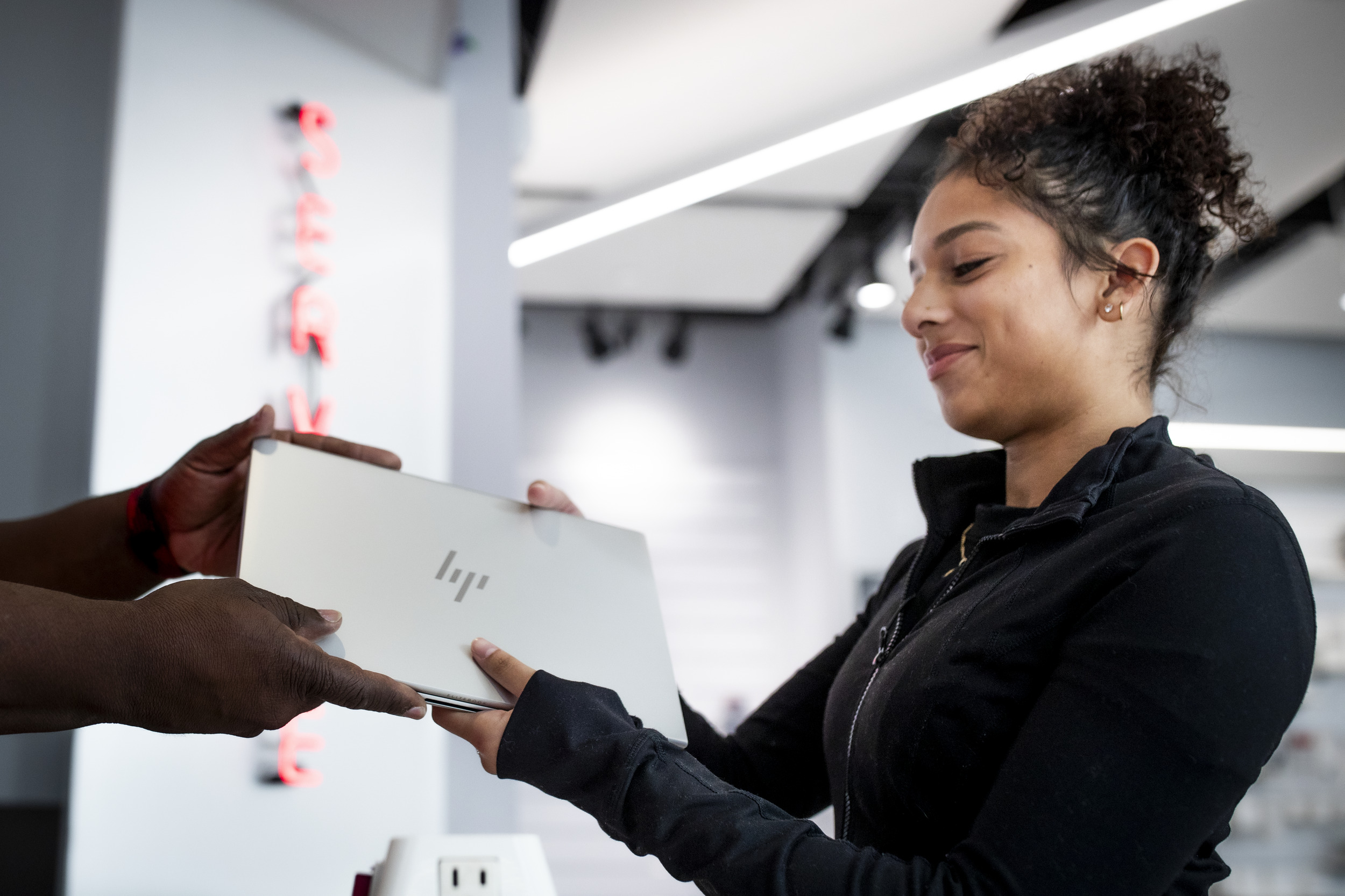 Image of student using a laptop at Temple’s Digital Access Center.