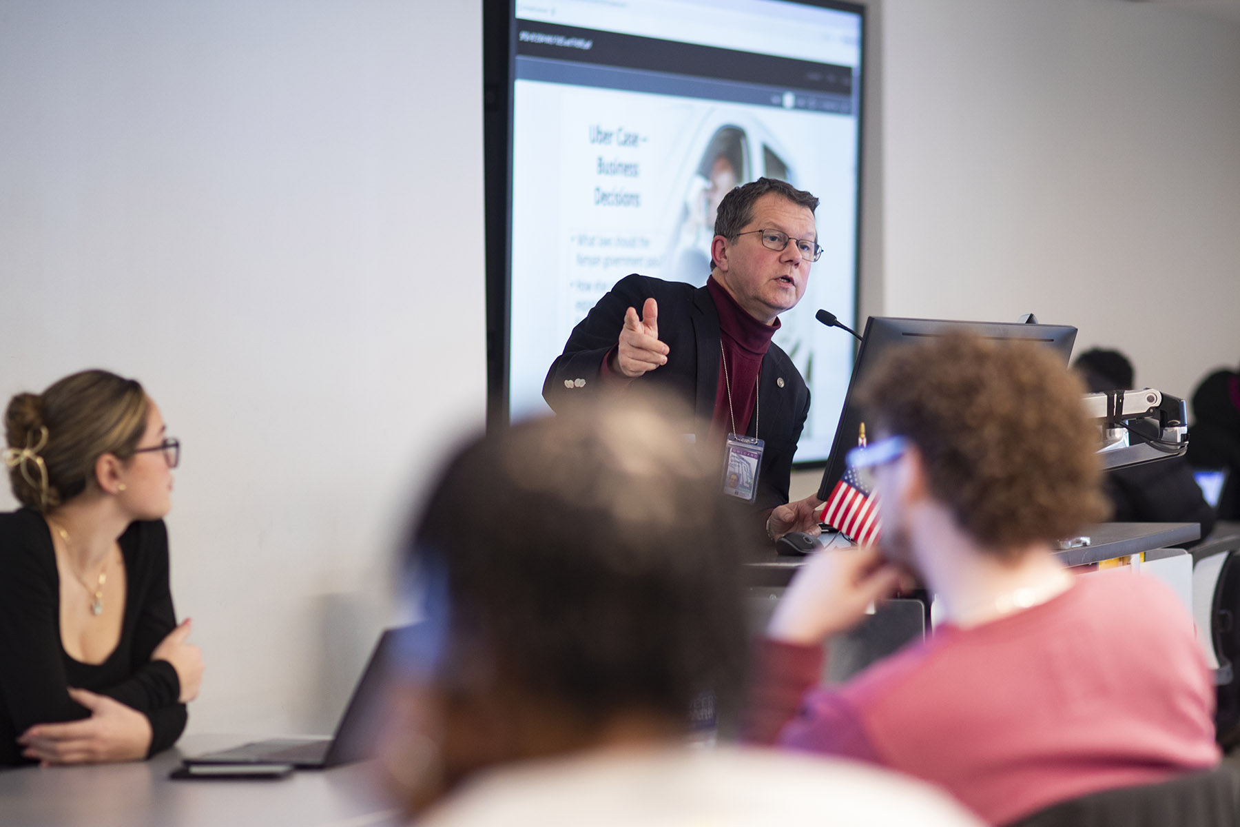Bertrand Guillotin, associate professor of instruction at Temple University’s Fox School of Business, leads a class discussion on an Uber case study.