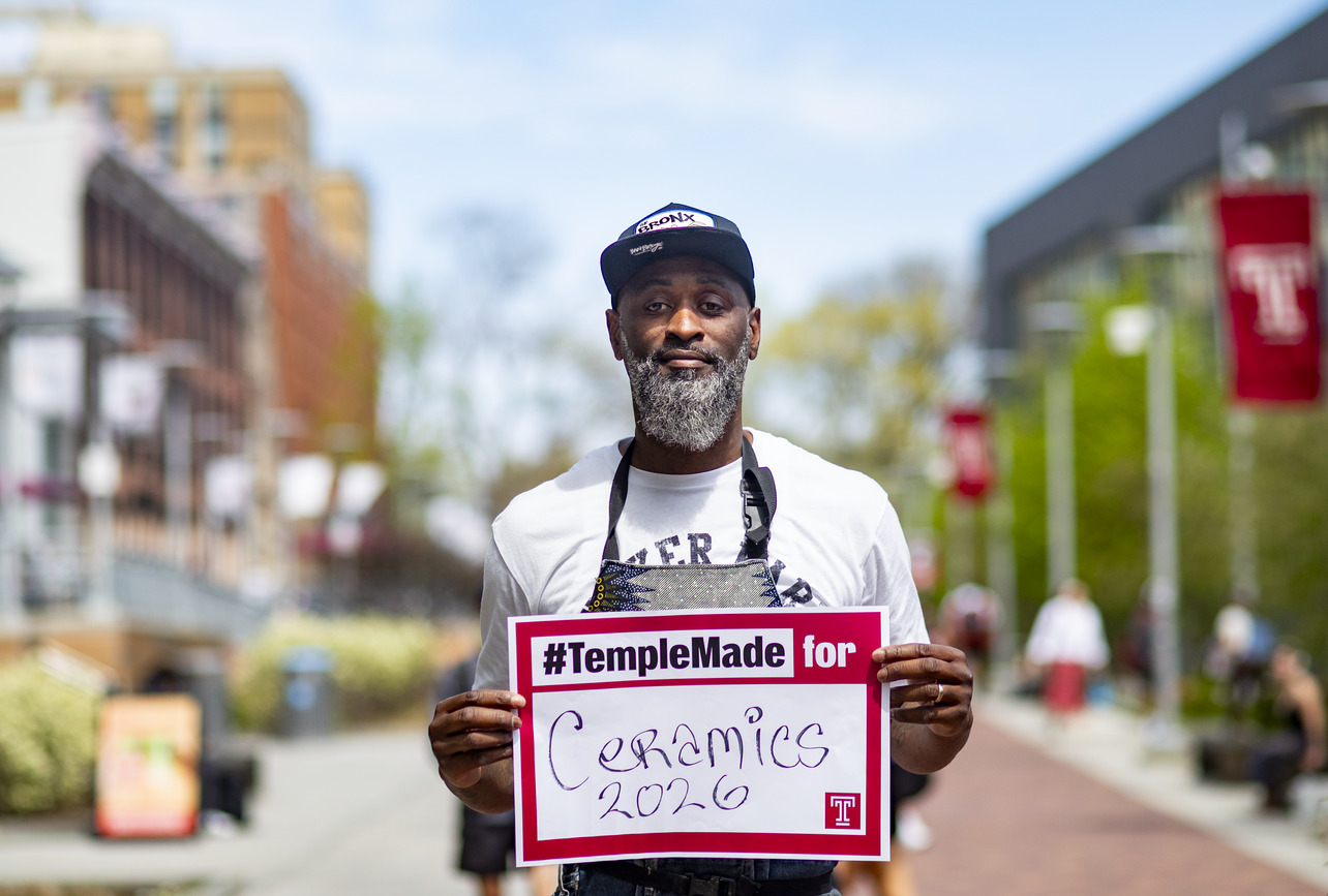 Rich Brown holding a sign