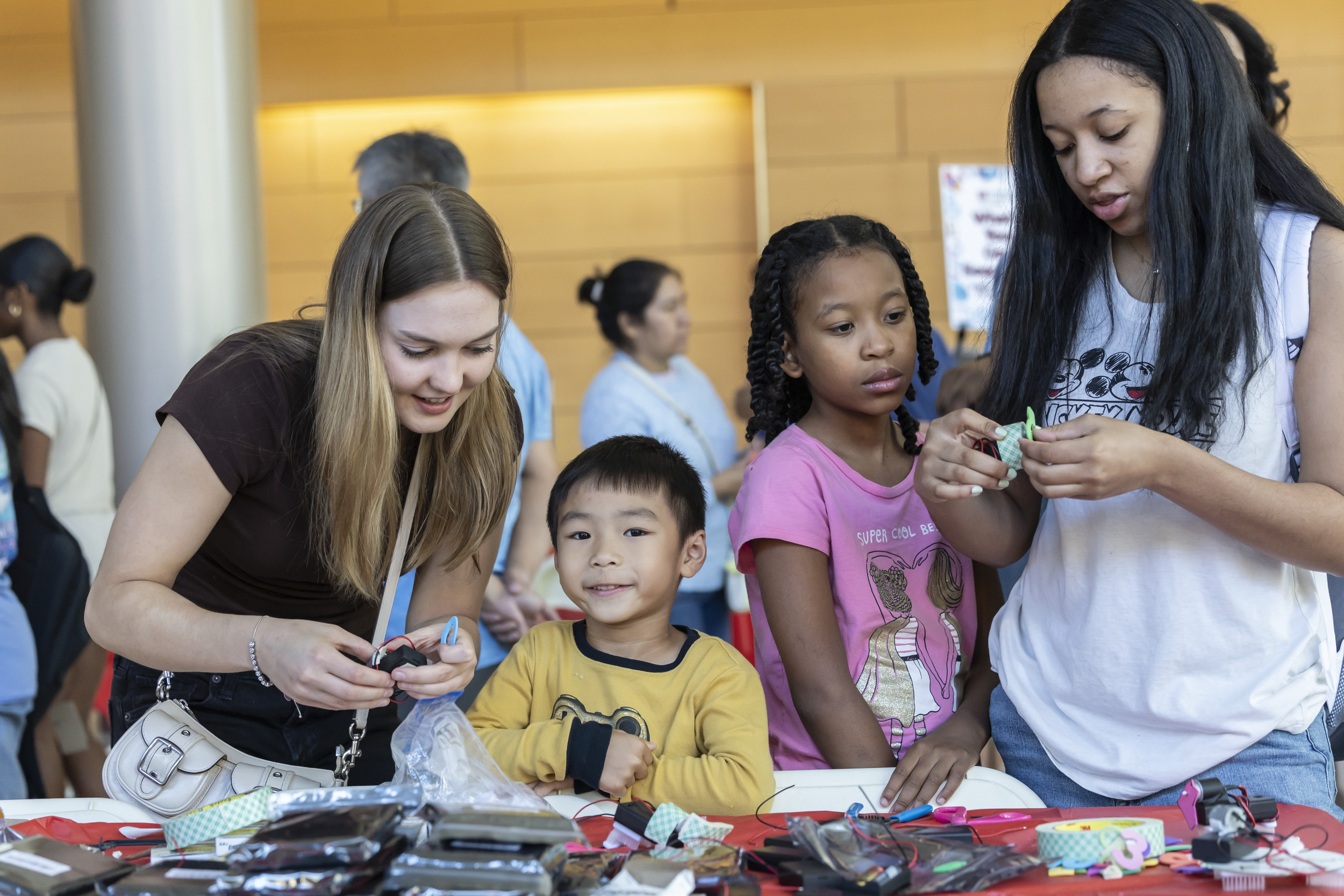 Image of attendees working at a work station during the STEMM Fair.