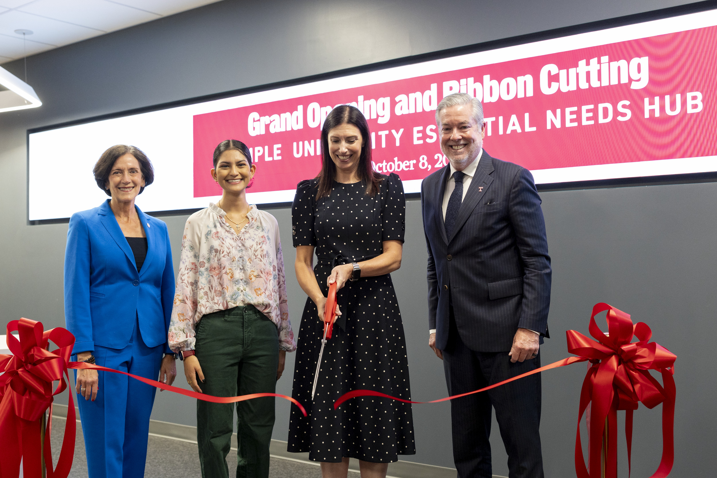 Jodi Bailey Accavallo cutting the ribbon at the Essential Needs Hub alongside Temple President John Fry, Alexis Gonsalves and Valerie Arkoosh