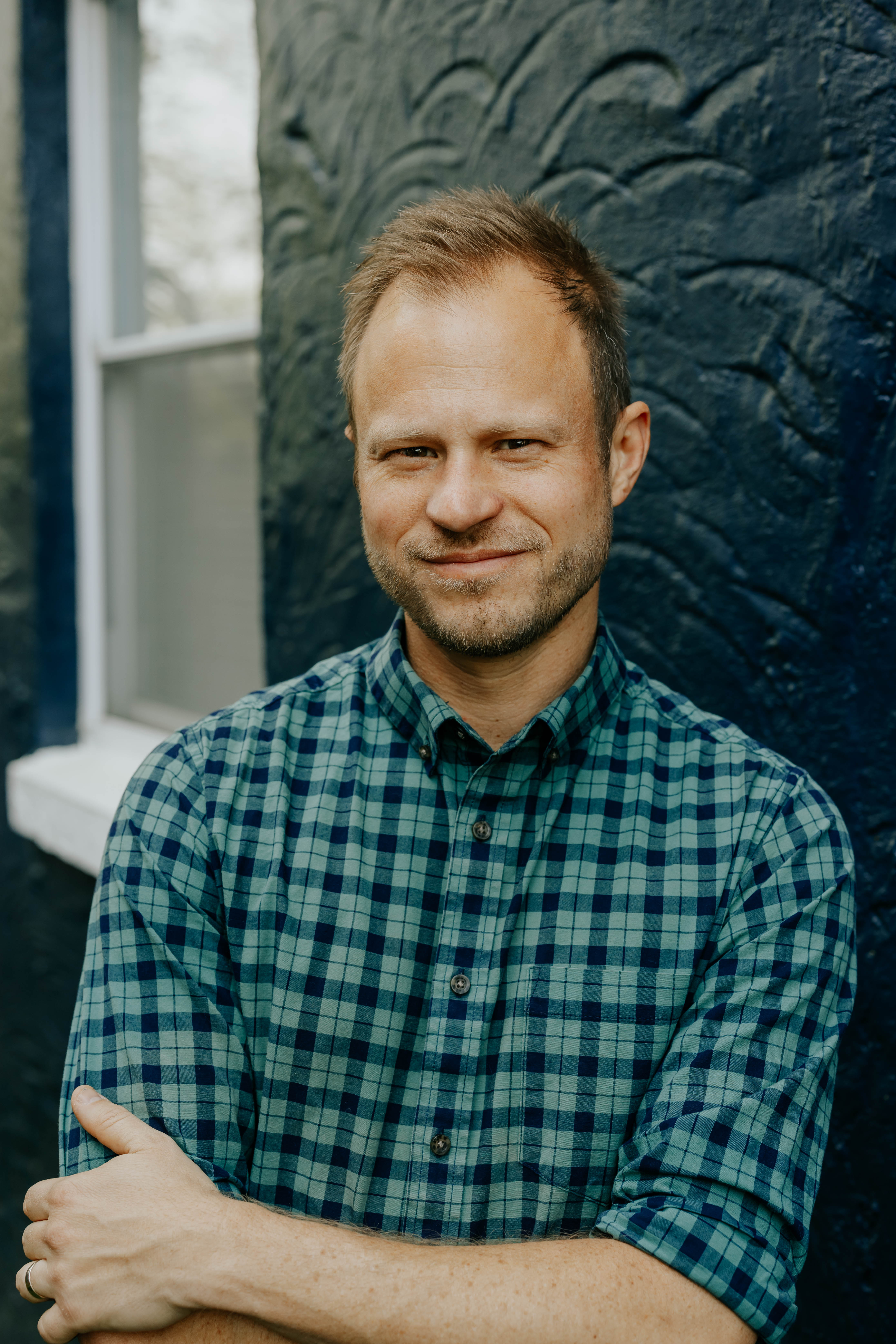 Tore Olsson with arms crossed looking at the camera