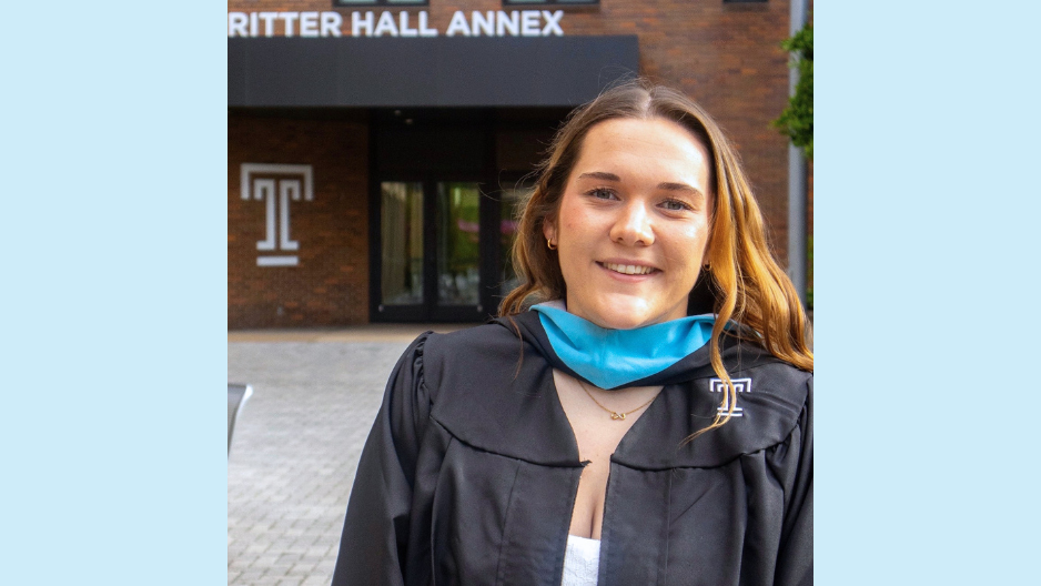 Photo of Abigail Groover in graduation gown, smiling.