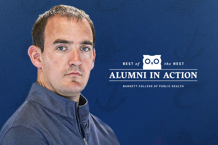 Jacob Legan headshot on blue background.