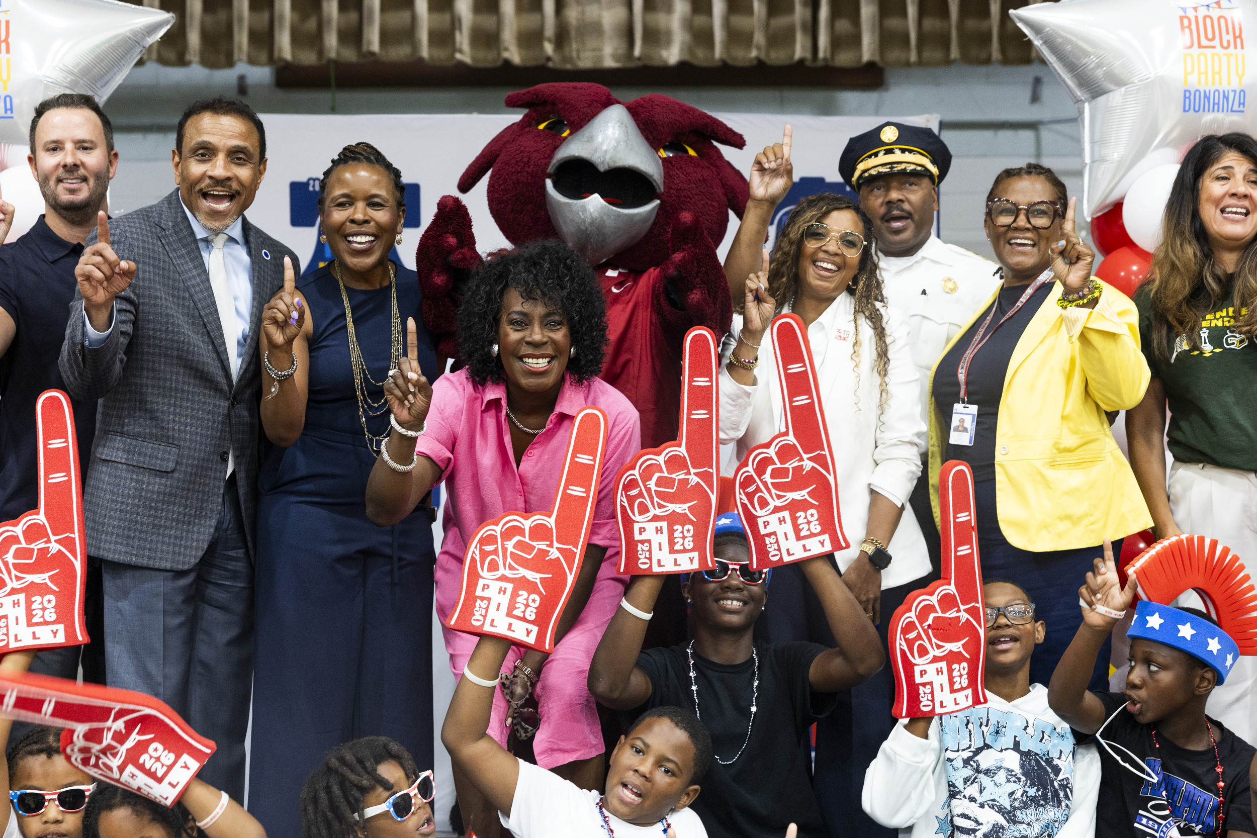 Hooter the owl and a group of leaders and students at the school block party.