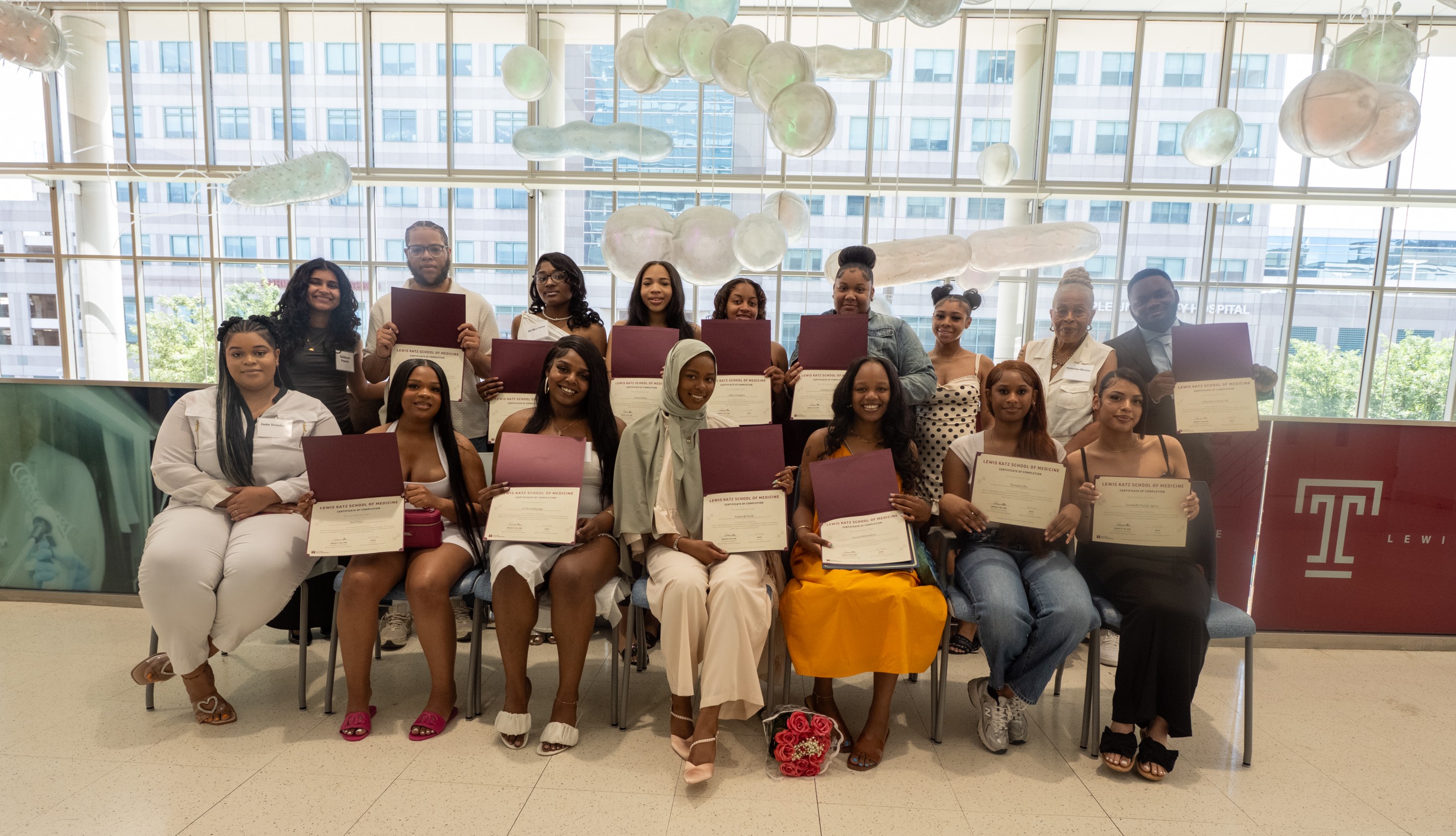 BUILD Philly cohort members holding their completion certificates