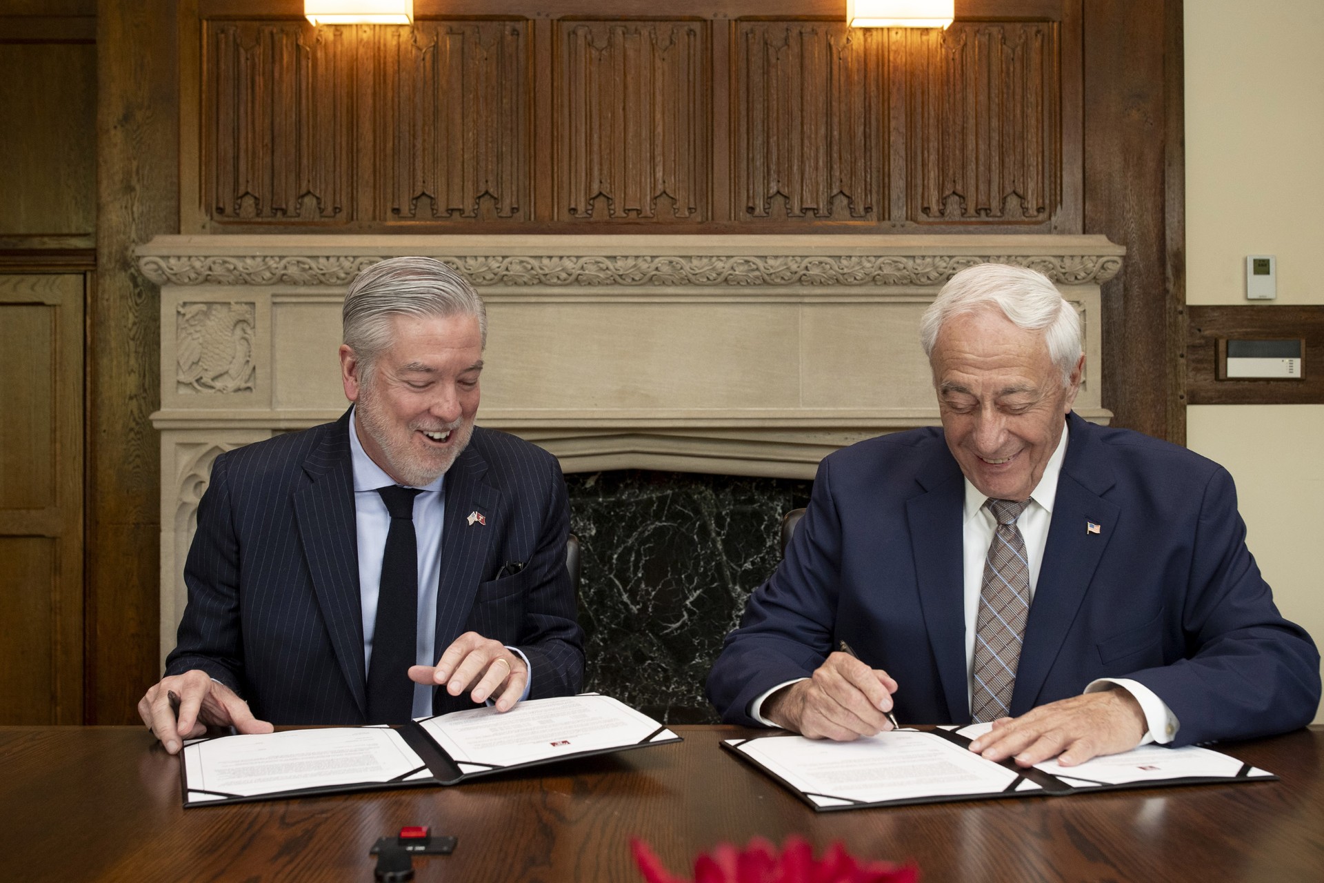Temple President John Fry is pictured with donor Marvin Samson as they sign the gift agreement.