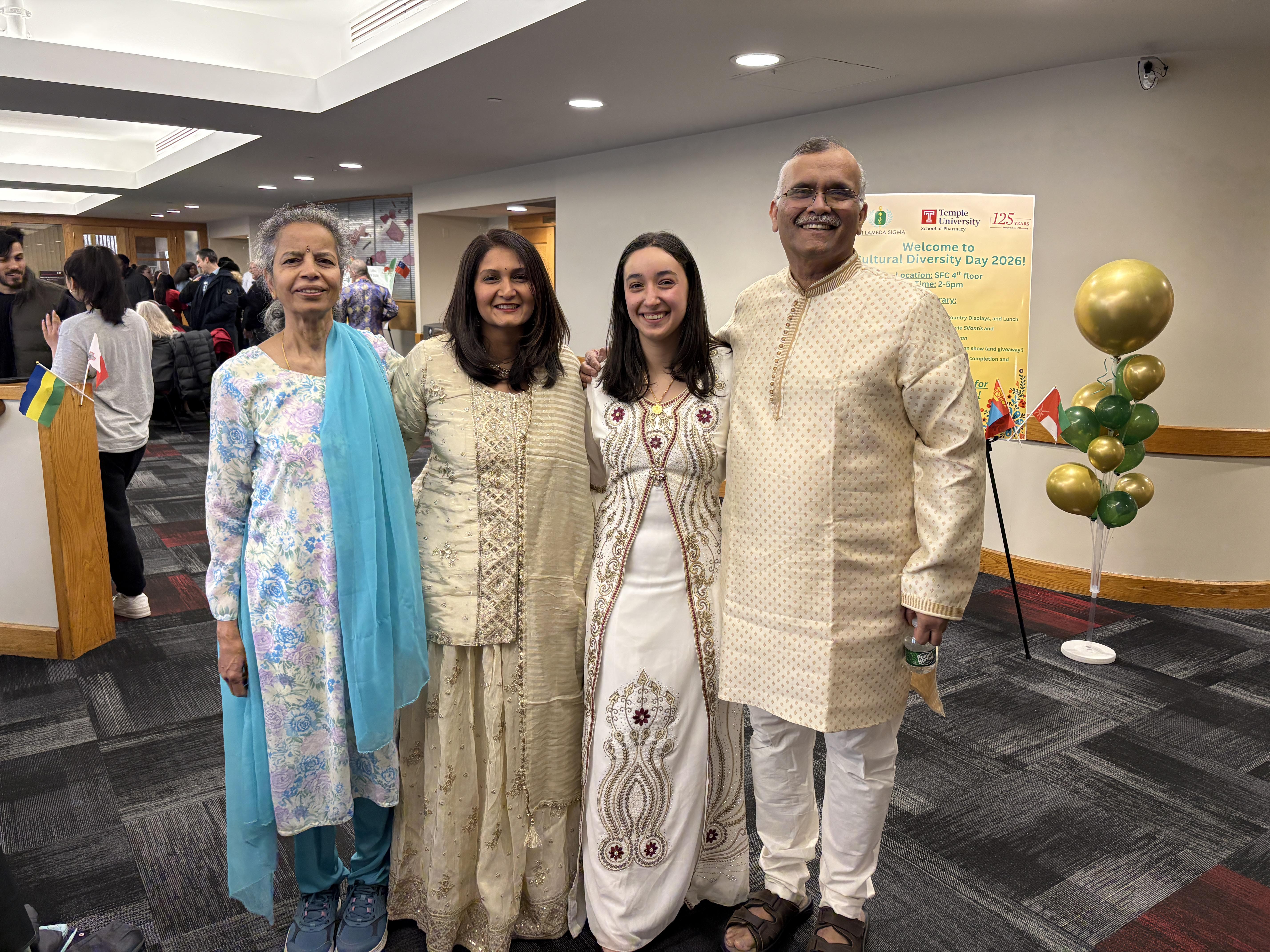 Students and faculty wearing cultural fashions