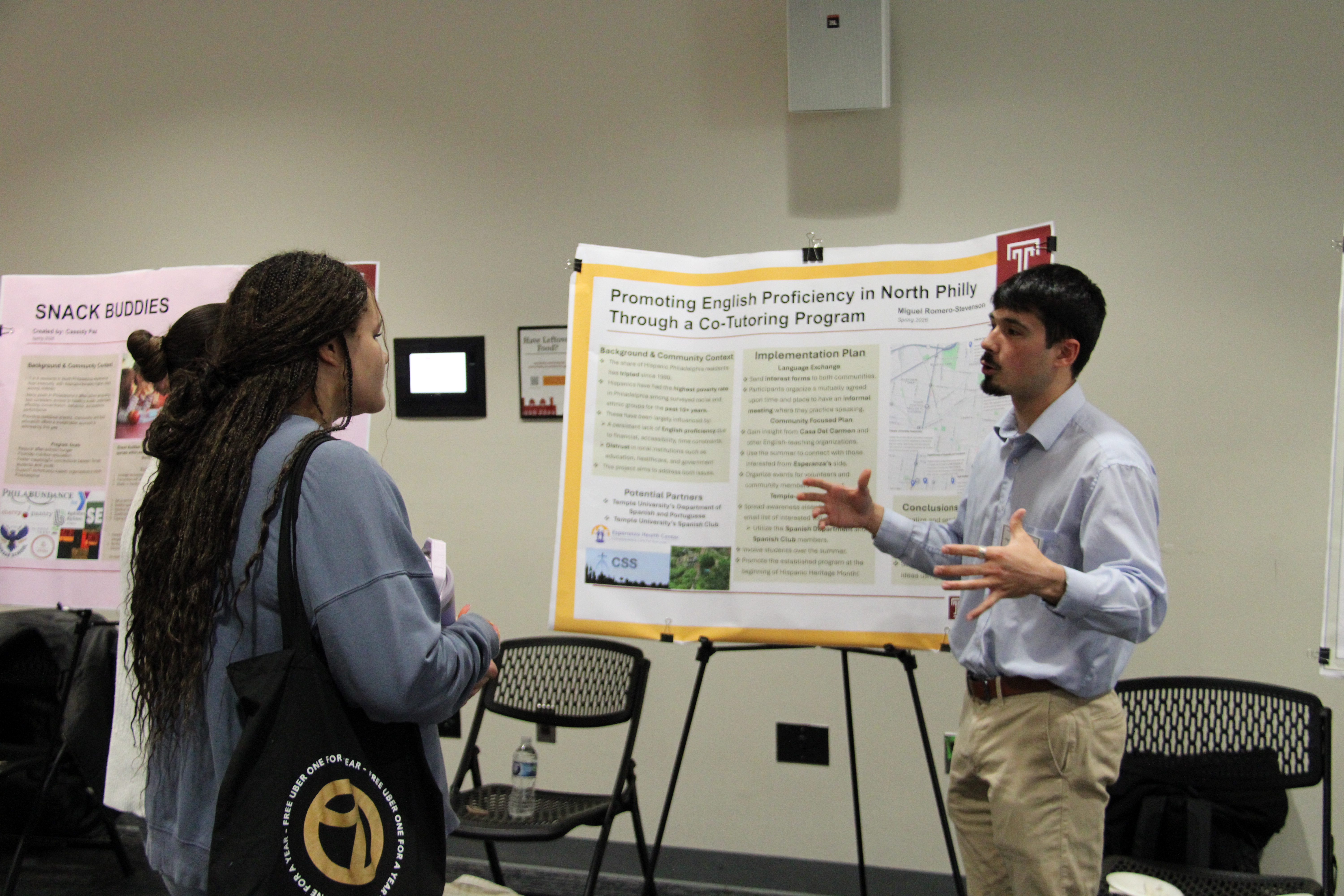 Community scholar presents his work to attendees