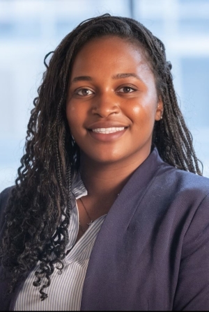 A headshot photo of Faye Majekodunmi. She is looking forward and smiling.