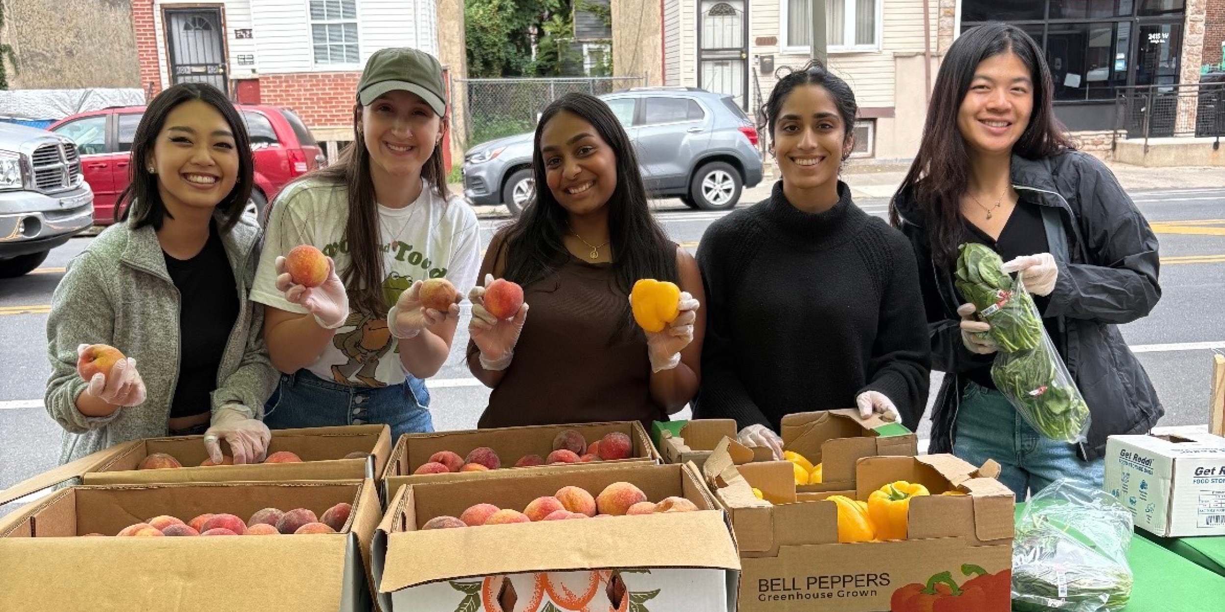 Temple medical school students from TEAC distribute free fruits and vegetables in North Philadelphia to help address food insecurity.