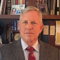 Philip Wasielewski in front of his bookshelf